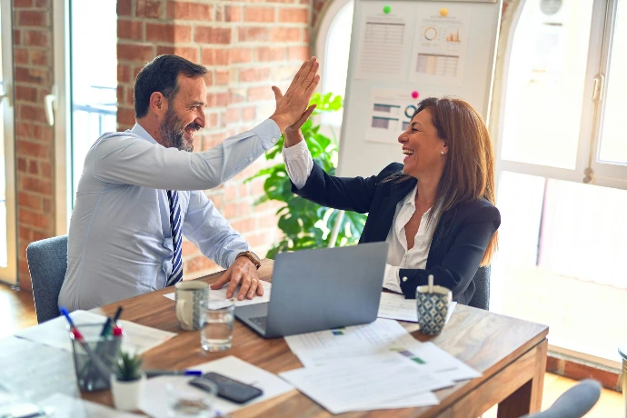 Team discussing documents during a business meeting