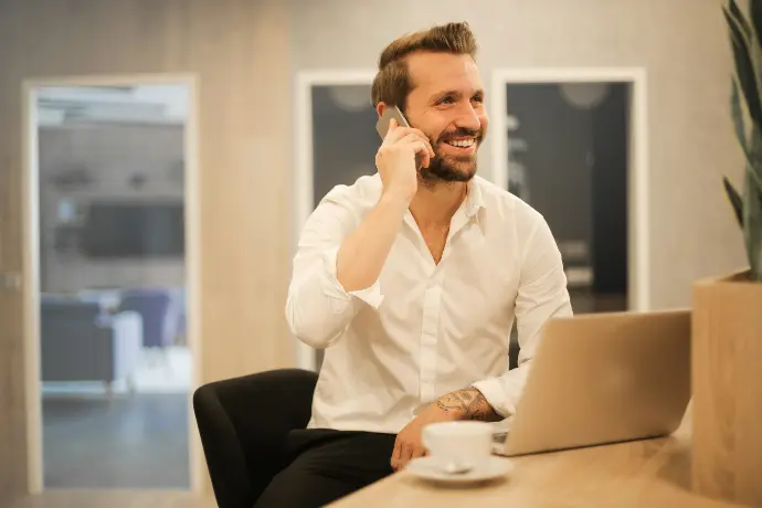 Man using smartphone on chair