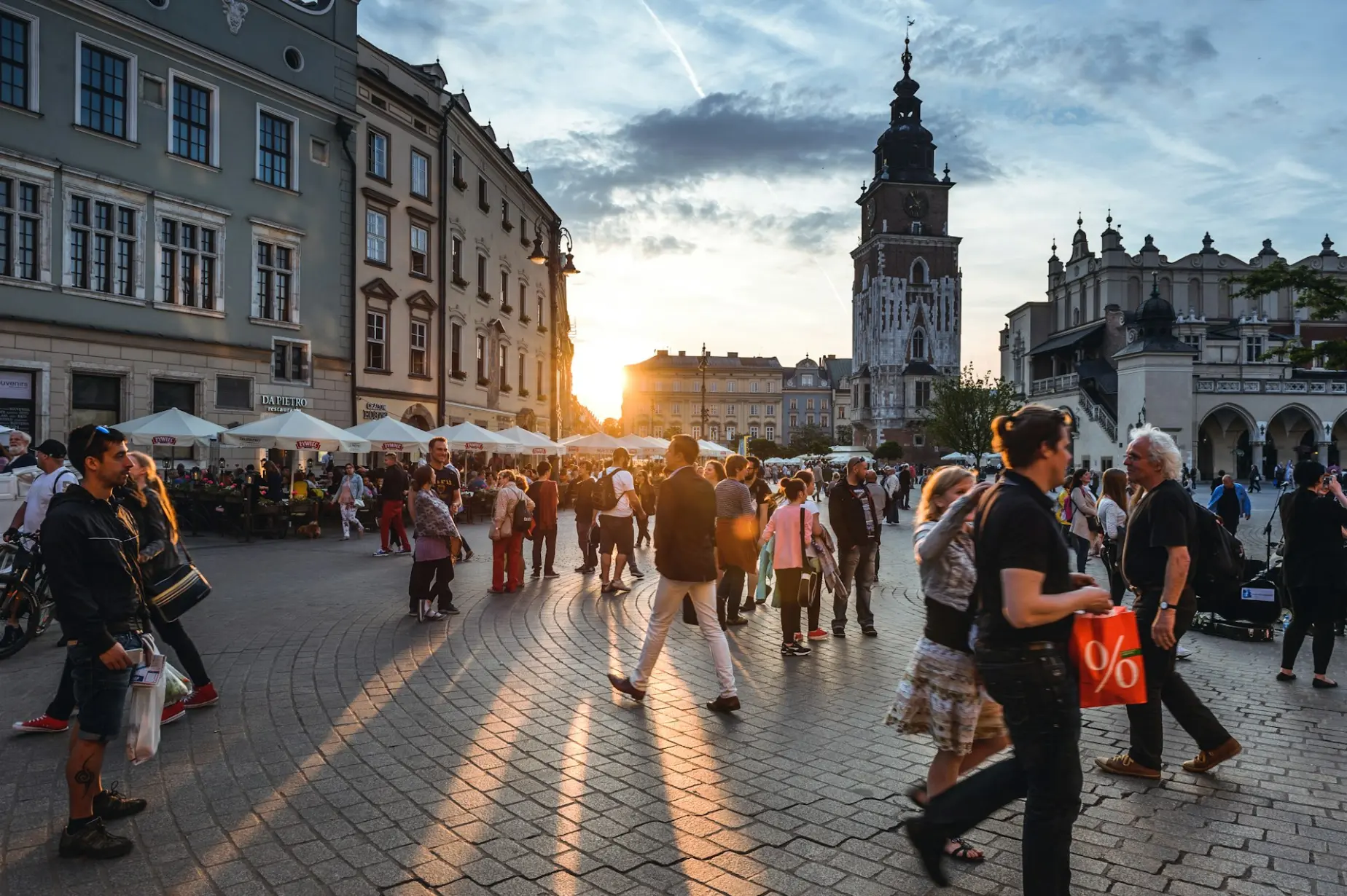 People walking on street near concrete buildings