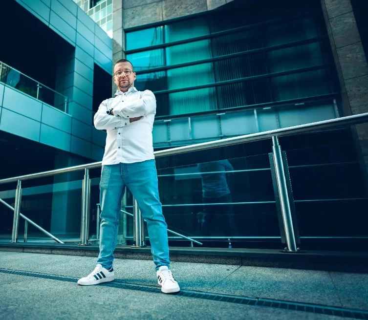 Man standing confidently in modern office environment